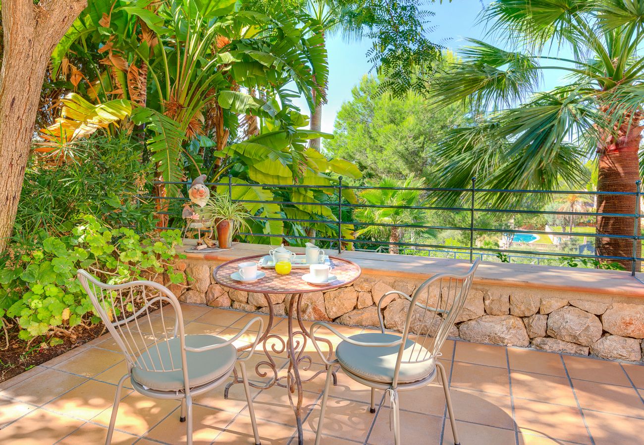 Balcony with views of the garden and pool.