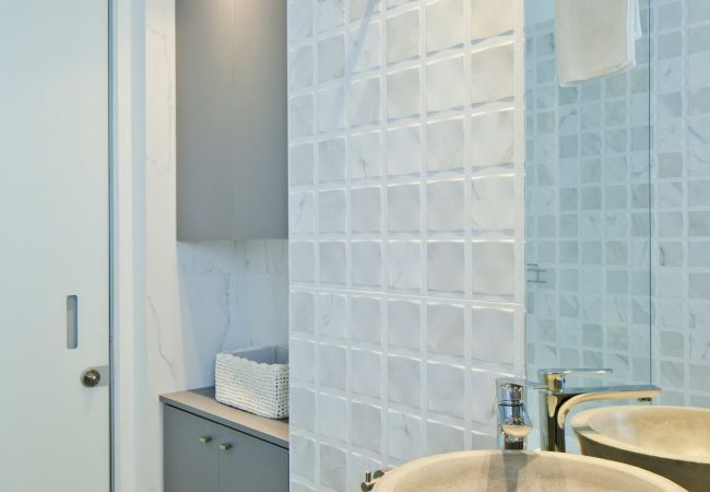 Cute bathroom with modern sink and a mirror in apartment on Ben Yehuda st.