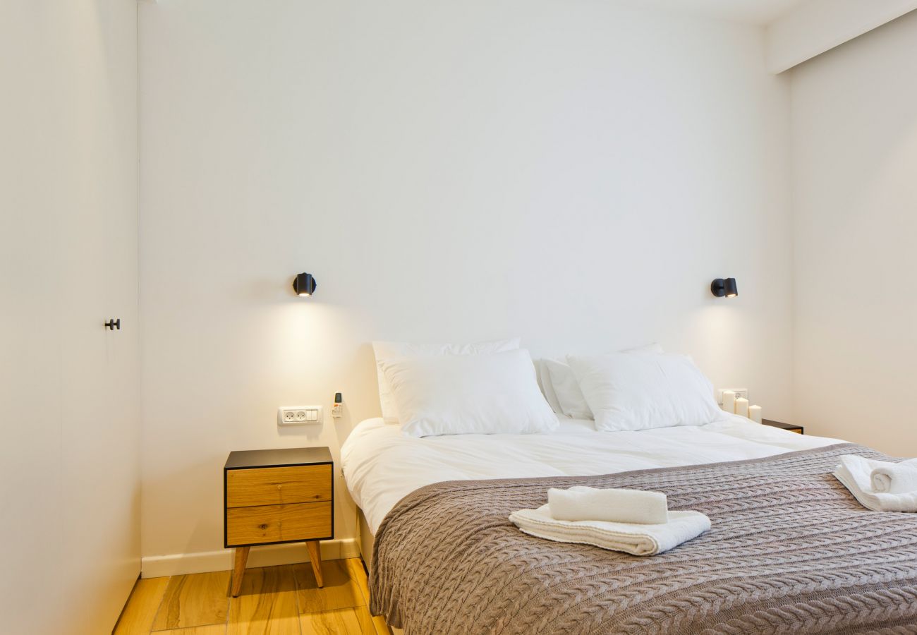 Cozy bedroom with big comfy bed in apartment on Ben Yehuda st.