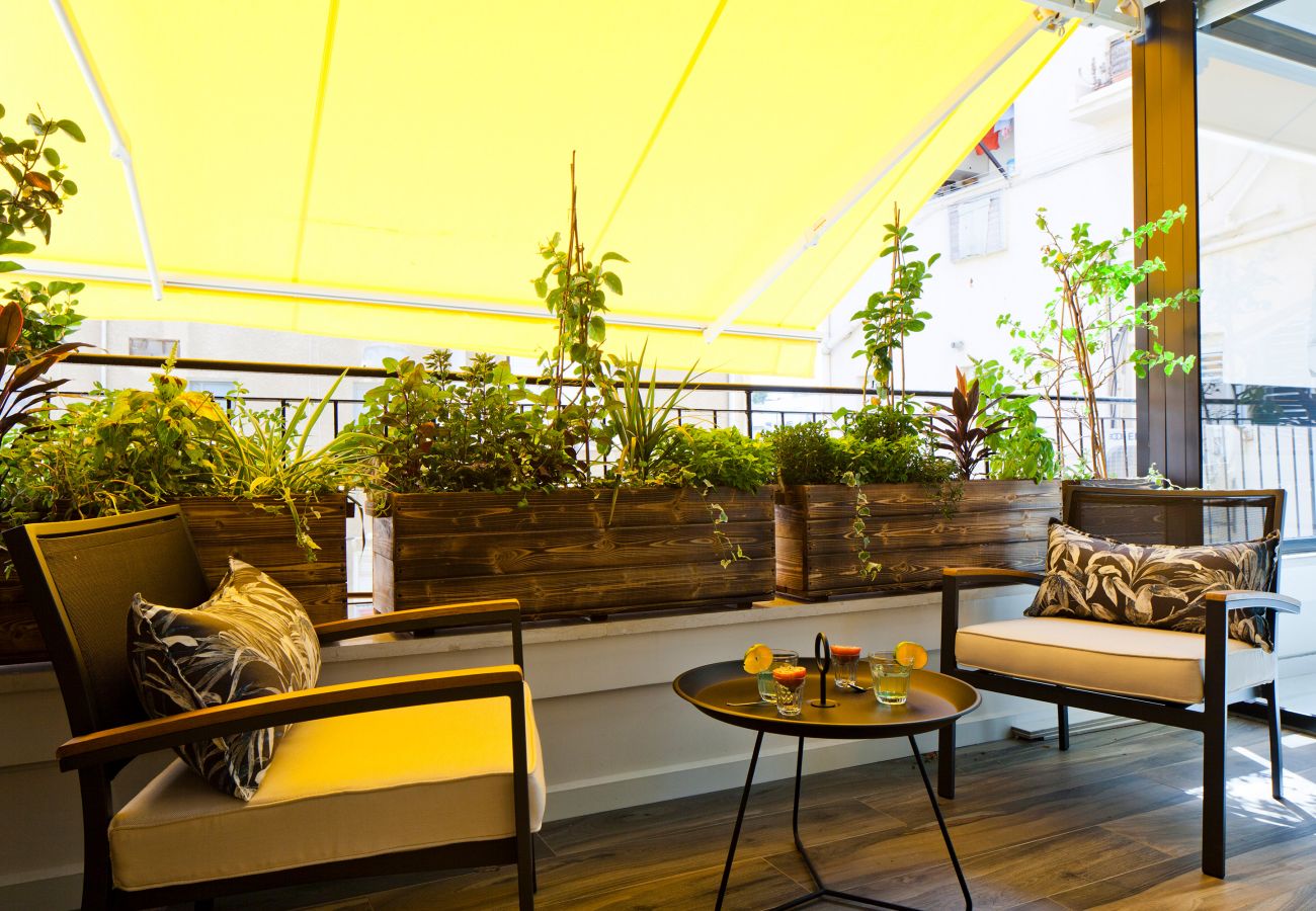 Incredible terrace with two beautiful chairs and a table in apartment on Ben Yehuda st.