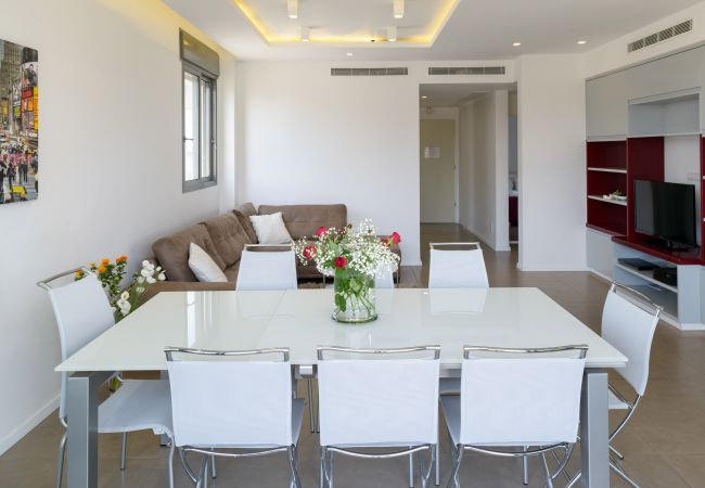 Beautiful dining area with a big table and chairs on Ben Yehuda st.