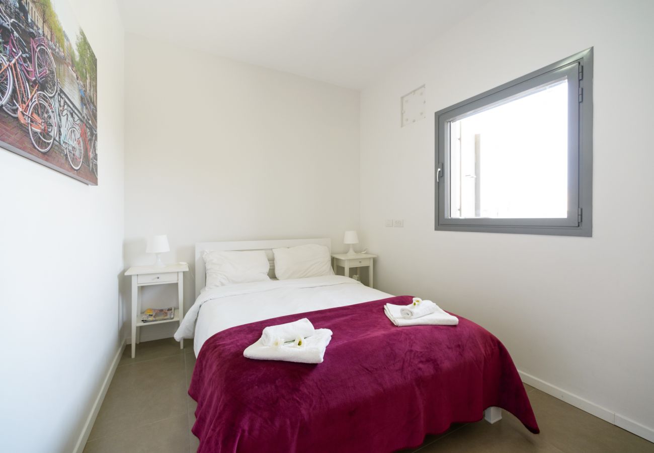 Beautiful bedroom with a big bed on Ben Yehuda st.