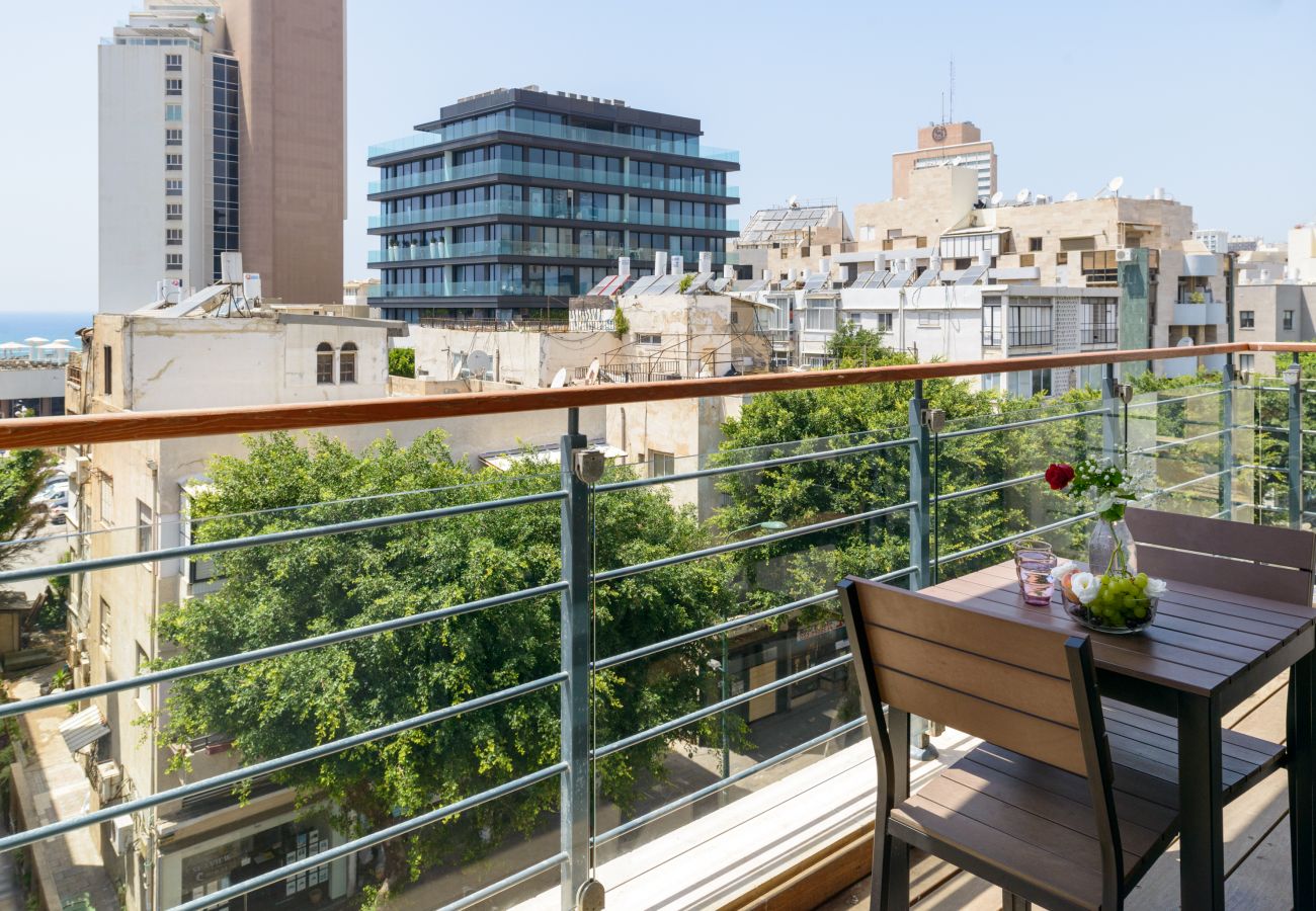 Incredible view from the balcony with two cute chairs and a table in apartment on Ben Yehuda st.