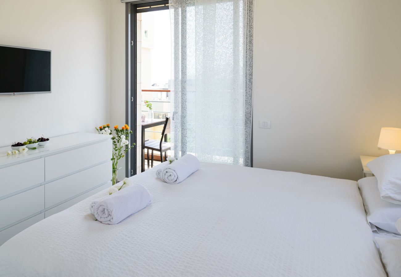 Charming bedroom with a comfy bed and a tv on Ben Yehuda st.