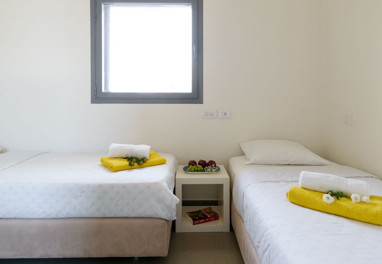 Cute bedroom with two comfy beds at apartment on Ben Yehuda st.
