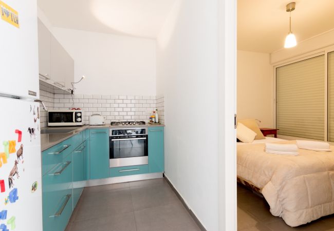 Colorful kitchen with all necessities and cozy bedroom in apartment on Florentin