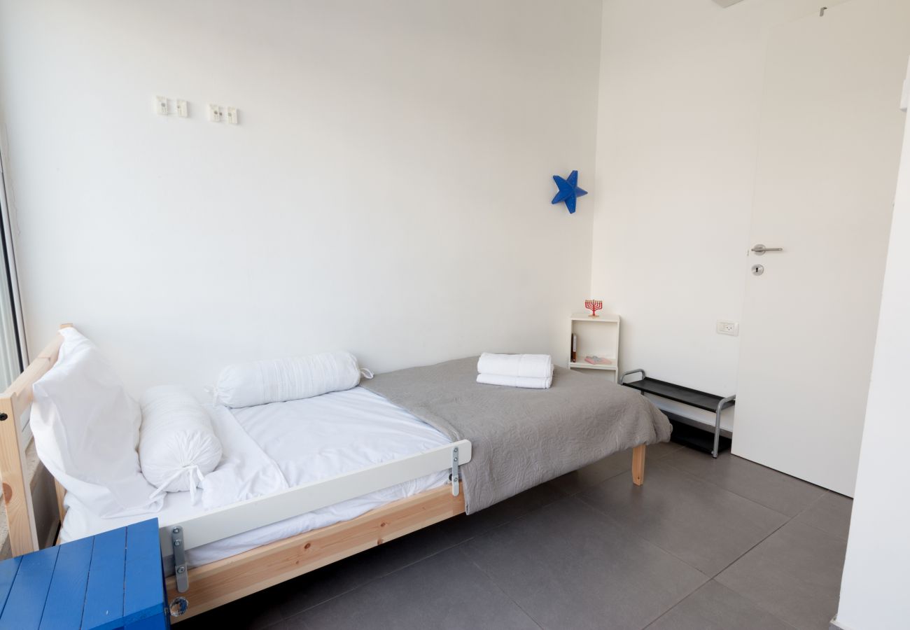 Beautiful bedroom with comfy single bed in apartment in Florentine